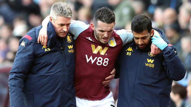 John McGinn hobbles off after picking up an injury