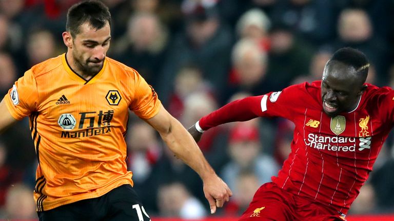 Wolves' Jonny and Liverpool's Sadio Mane battle for the ball