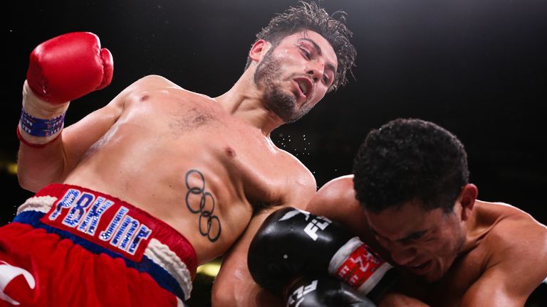 December 20, 2019; Phoenix, AZ, USA; Josh Kelly and Winston Campos during their December 20, 2019 Matchroom Boxing USA bout at the Talking Stick Resort Arena in Phoenix, AZ.  Mandatory Credit: Ed Mulholland/Matchroom Boxing USA