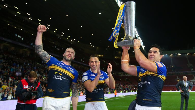 Picture by Alex Whitehead/SWpix.com - 10/10/2015 - Rugby League - First Utility Super League Grand Final - Leeds Rhinos v Wigan Warriors - Old Trafford, Manchester, England - (l-r) Leeds' Jamie Peacock, Kevin Sinfield and Kylie Leuluai celebrate with the trophy.