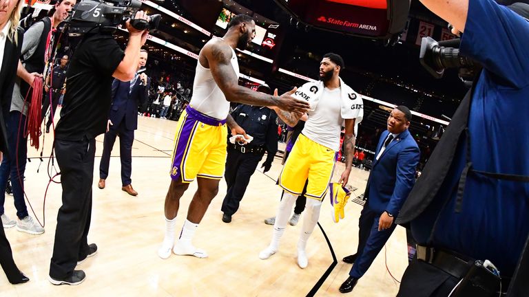  LeBron James of the Los Angeles Lakers and Anthony Davis of the Los Angeles Lakers high-five after a game against the Atlanta Hawks