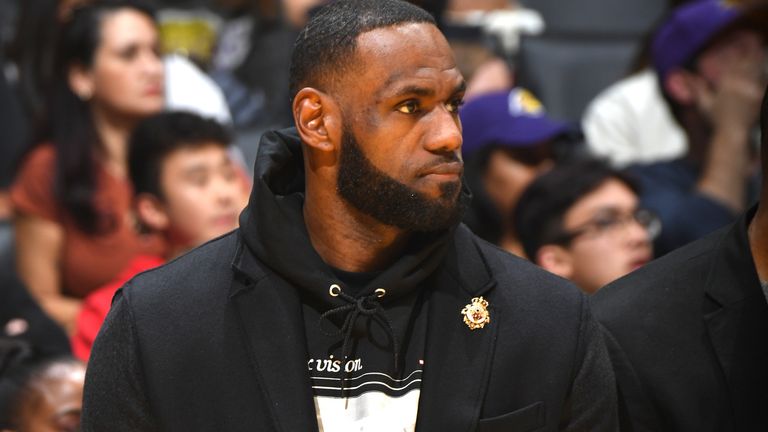 LeBron James watches on from the sideline during the Lakers' defeat to the Denver Nuggets