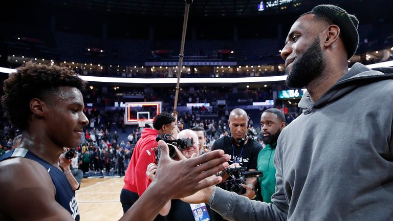 LeBron James congratulates Bronny James after his high school wins in Ohio on Saturday