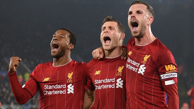 James Milner celebrates his goal with Liverpool's Jordan Henderson and Georginio Wijnaldum