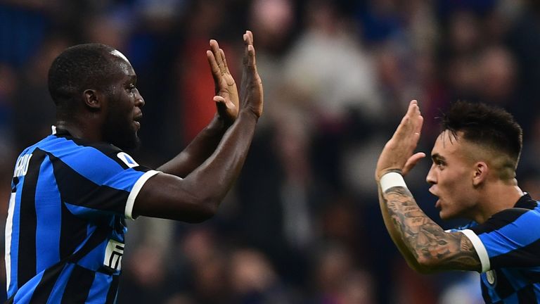 Inter Milan's Belgian forward Romelu Lukaku (L) celebrates with Inter Milan's Argentinian forward Lautaro Martinez after scoring an equalizer during the Italian Serie A football match Inter Milan vs Parma on October 26, 2019 at the San Siro stadium in Milan. (Photo by Miguel MEDINA / AFP) (Photo by MIGUEL MEDINA/AFP via Getty Images)