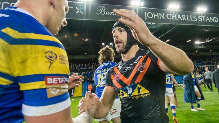 Picture by Allan McKenzie/SWpix.com - 23/03/2018 - Rugby League - Betfred Super League - Leeds Rhinos v Castleford Tigers - Elland Road, Leeds, England - Castleford's Luke Gale consoles Leeds' players after their victory 25 points to 24.