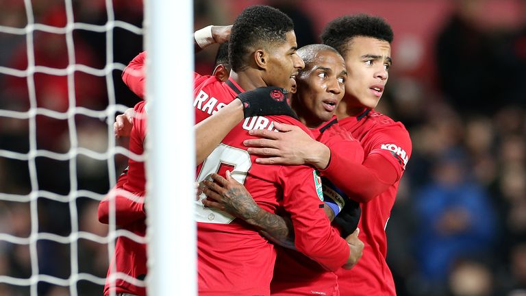 MANCHESTER, ENGLAND - DECEMBER 18: Marcus Rashford, Ashley Young and Mason Greenwood of Manchester United celebrate the third goal during the Carabao Cup Quarter Final match between Manchester United and Colchester United at Old Trafford on December 18, 2019 in Manchester, England. (Photo by John Peters/Manchester United via Getty Images)
