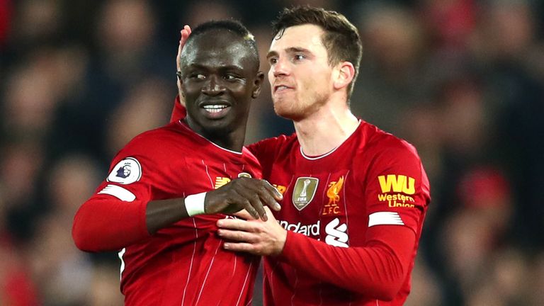 Liverpool's Andy Robertson and Sadio Mane celebrate going 1-0 up against Wolves.