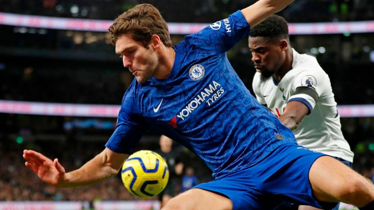 Chelsea's Spanish defender Marcos Alonso (L) vies with Tottenham Hotspur's Ivorian defender Serge Aurier (R) during the English Premier League football match between Tottenham Hotspur and Chelsea at Tottenham Hotspur Stadium in London, on December 22, 2019. 