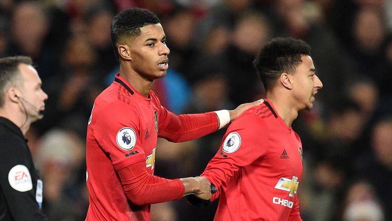 Manchester United&#39;s English striker Marcus Rashford (C) celebrates with Manchester United&#39;s English midfielder Jesse Lingard (R) after scoring their second goal from the penalty spot during the English Premier League football match between Manchester United and Tottenham Hotspur at Old Trafford in Manchester, north west England, on December 4, 2019.