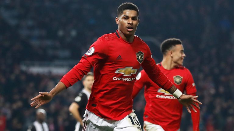 Marcus Rashford wheels away in celebration after making it 3-1