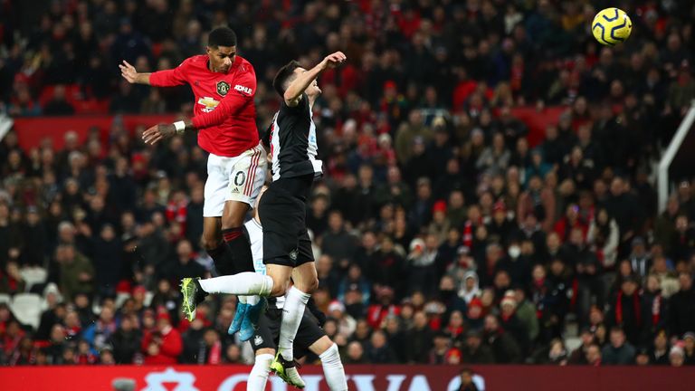 Marcus Rashford rises above Fabian Schar to head in Manchester United&#39;s third