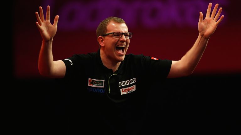 Mark Webster of Wales celebrates victory in his third round match against Raymond van Barneveld of Holland on day twelve of the Ladbrokes.com World Darts Championship at Alexandra Palace on December 27, 2013 in London, England