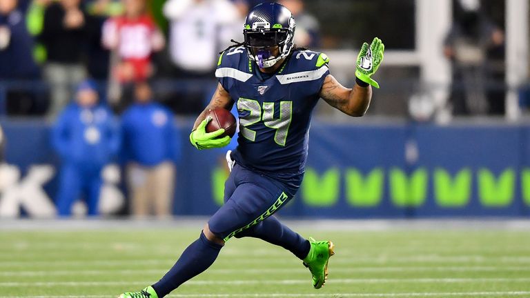 Lynch rushed for 34 yards and one touchdown off 12 carries in his first game since re-signing for the Seahawks