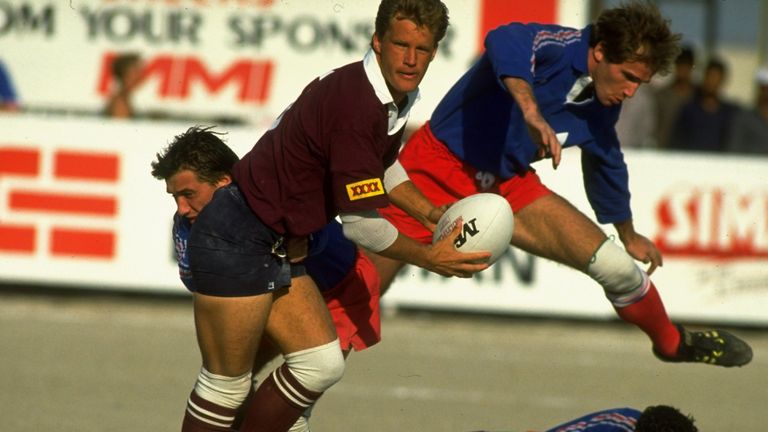 1990: Michael Lynagh (left) of Queensland is tackled during the Dubai Sevens match against Toulouse in Dubai, United Arab Emirates. \ Mandatory Credit: Russell Cheyne/Allsport