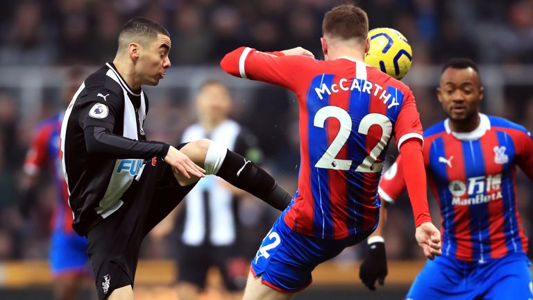 Miguel Almiron and Crystal Palace&#39;s James McCarthy battle for the ball