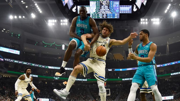 Robin Lopez  (centre) of the Milwaukee Bucks started in place of his brother Brook Lopez on Saturday against the Charlotte Hornets 