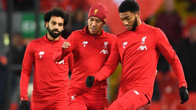 Mohamed Salah, Roberto Firmino and Joe Gomez of Liverpool warm up prior to the Merseyside Derby