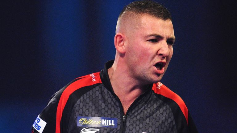 Nathan Aspinall of England celebrates in his Quarter-Final match against Dimitri Van den Bergh of Belgium during Day Fourteen of the 2020 William Hill World Darts Championship at Alexandra Palace on December 29, 2019 in London, England.