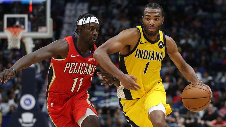 NEW ORLEANS, LOUISIANA - DECEMBER 28: T.J. Warren #1 of the Indiana Pacers drives the ball around Jrue Holiday #11 of the New Orleans Pelicans at Smoothie King Center on December 28, 2019 in New Orleans, Louisiana. NOTE TO USER: User expressly acknowledges and agrees that, by downloading and/or using this photograph, user is consenting to the terms and conditions of the Getty Images License Agreement (Photo by Chris Graythen/Getty Images)
