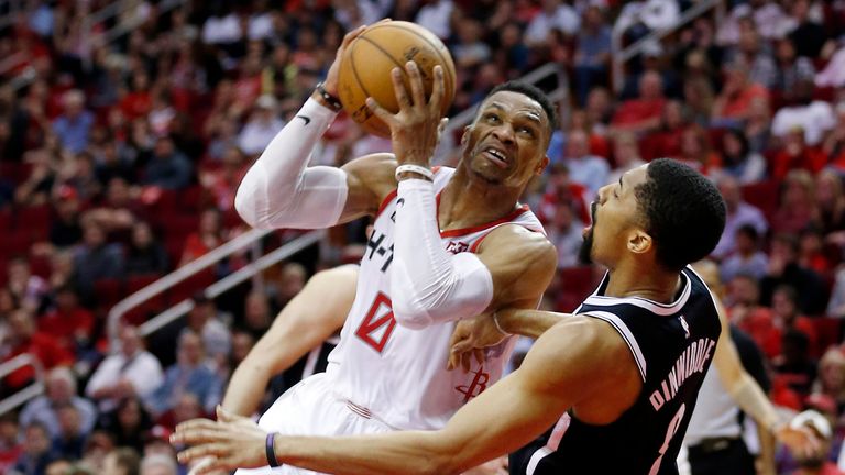 HOUSTON, TEXAS - DECEMBER 28: Russell Westbrook #0 of the Houston Rockets is called for an offensive foul as he knocks over Spencer Dinwiddie #8 of the Brooklyn Nets at Toyota Center on December 28, 2019 in Houston, Texas. NOTE TO USER: User expressly acknowledges and agrees that, by downloading and/or using this photograph, user is consenting to the terms and conditions of the Getty Images License Agreement. (Photo by Bob Levey/Getty Images)
