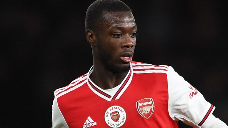 Nicolas Pepe has possession of the ball during Arsenal's match against Manchester City in December
