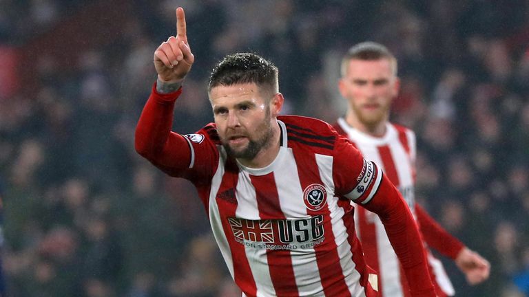 Oliver Norwood celebrates his equaliser from the penalty spot