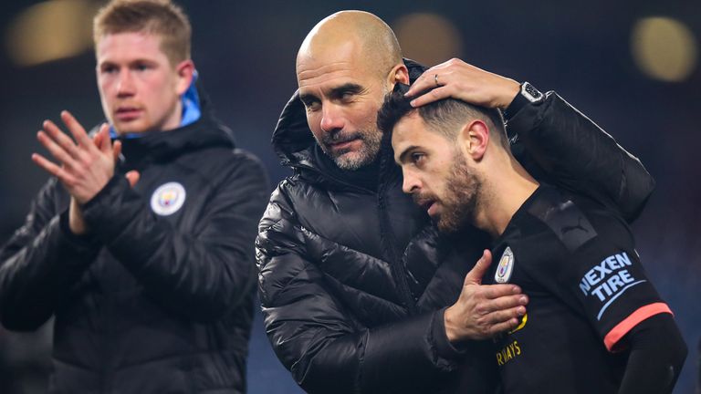 BURNLEY, ENGLAND - DECEMBER 03: Pep Guardiola the head coach / manager of Manchester City and Bernardo Silva of Manchester City during the Premier League match between Burnley FC and Manchester City at Turf Moor on December 3, 2019 in Burnley, United Kingdom. (Photo by Robbie Jay Barratt - AMA/Getty Images)