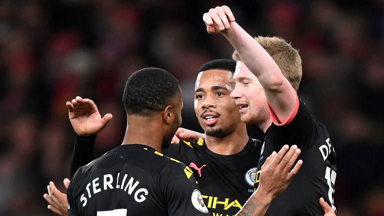 Raheem Sterling celebrates scoring for Manchester City against Arsenal with Gabriel Jesus and Kevin De Bruyne 