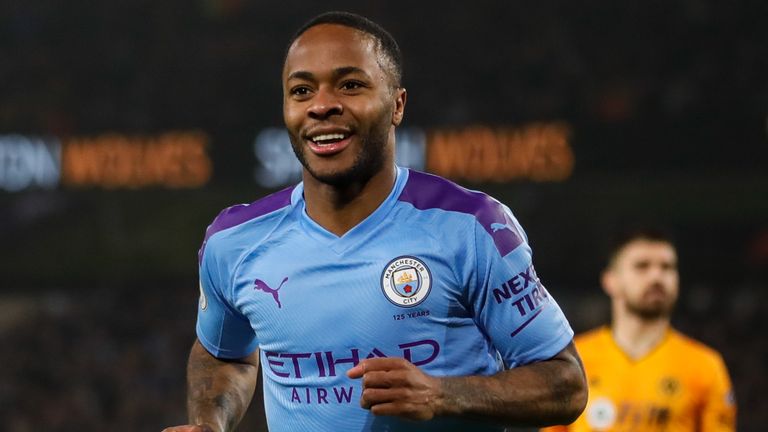 Raheem Sterling celebrates scoring from the penalty spot for Manchester City against Wolves