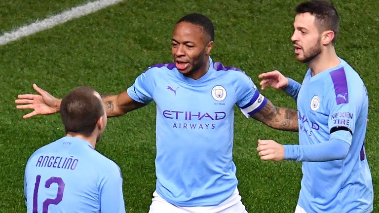 OXFORD, ENGLAND - DECEMBER 18: Raheem Sterling of Manchester City celebrates with teammates Bernardo Silva and Angelino after scoring his team's second goal during the Carabao Cup Quarter Final match between Oxford United and Manchester City at Kassam Stadium on December 18, 2019 in Oxford, England. (Photo by Justin Setterfield/Getty Images)