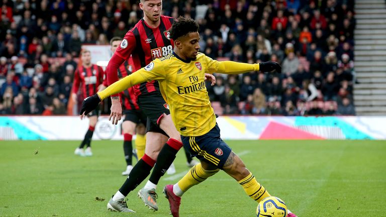 Reiss Nelson in action as Jack Simpson looks on