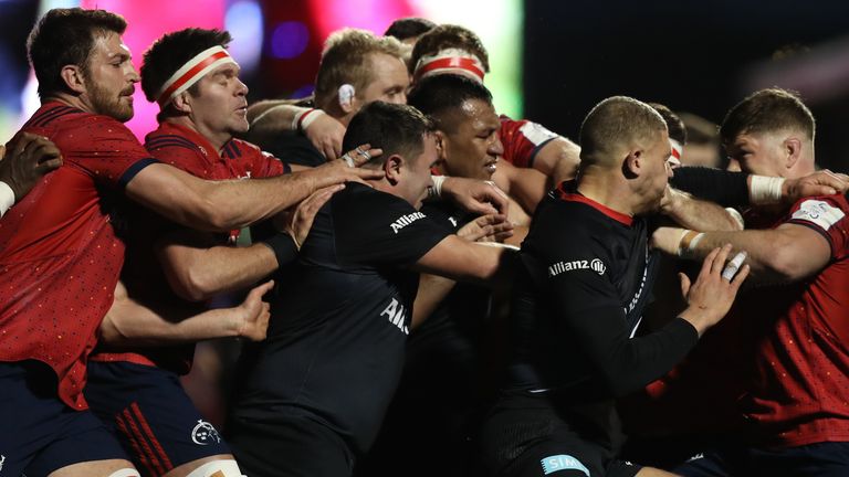 Saracens and Munster players clash