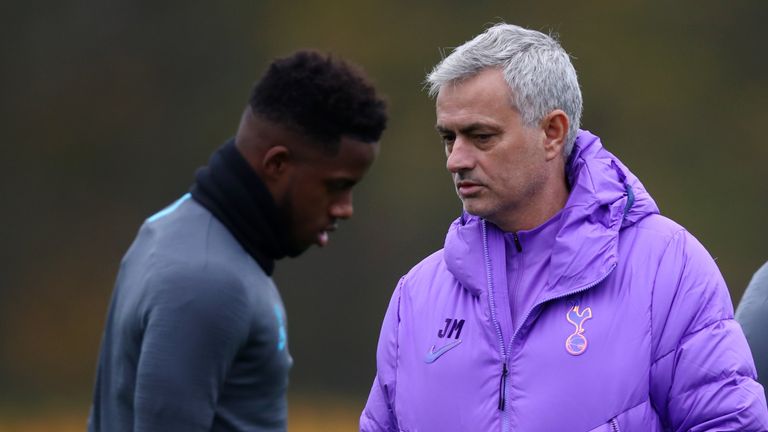 Jose Mourinho talks to Ryan Sessegnon during a Tottenham training session