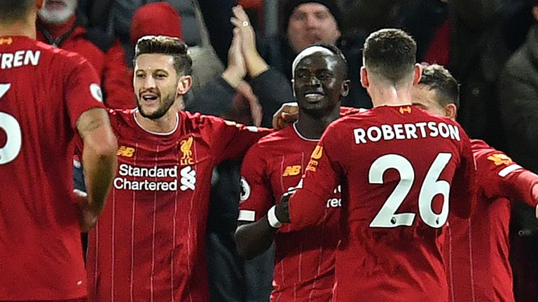 Sadio Mane celebrates with team-mats after scoring Liverpool's fourth goal