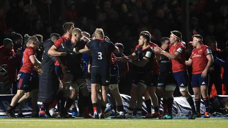 A fight breaks out between Saracens and Munster players during the European Rugby Champions Cup pool four match at Allianz Park.