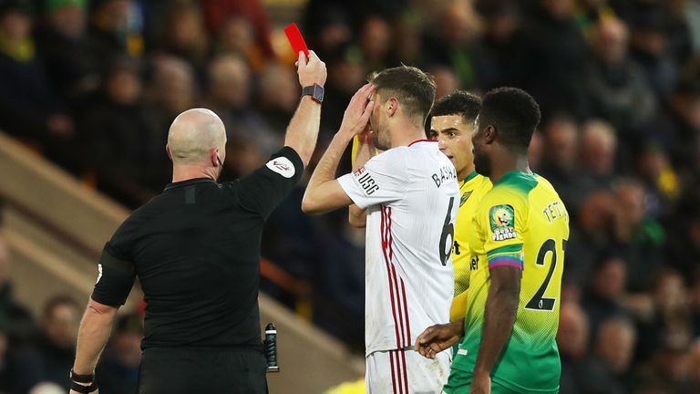 Chris Basham was initially shown a straight red card by referee Simon Hooper - before VAR intervened