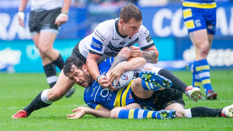 Picture by Allan McKenzie/SWpix.com - 27/07/2019 - Rugby League - Coral Challenge Cup Semi Final - Warrington Wolves v Hull FC - University of Bolton Stadium, Bolton, England - Warrington's Stefan Ratchford is tackled by Hull FC's Jordan Lane.