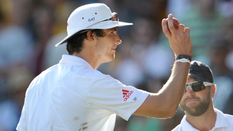 Steven Finn holds the ball up to the crowd after taking six wickets for England in the Ashes Test in Brisbane in 2010