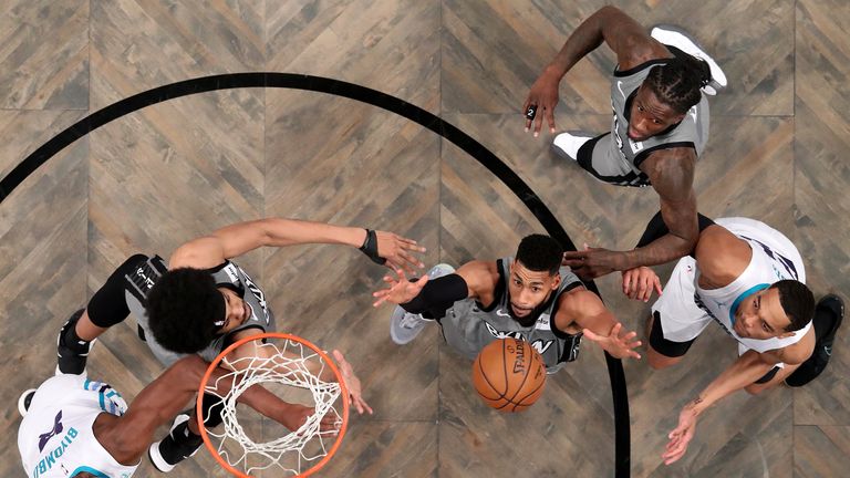 Garrett Temple of the Brooklyn Nets reaches for the rebound during their game against the Charlotte Hornets