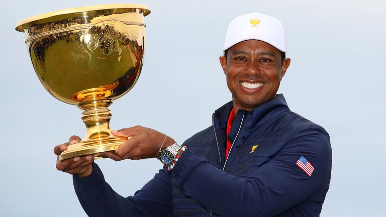 Tiger Woods with the Presidents Cup trophy