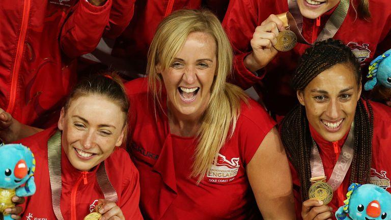 The former head coach and her players celebrating new netballing history