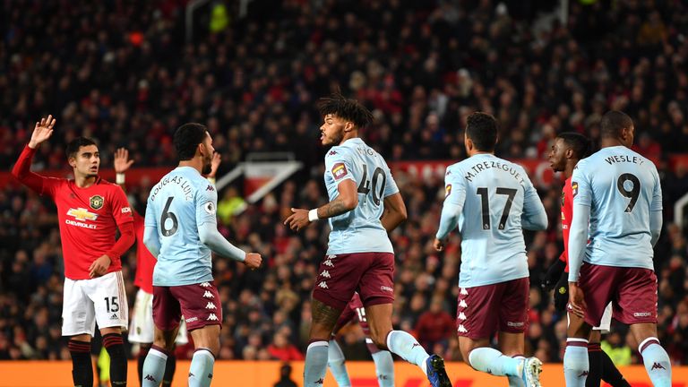 Tyrone Mings wheels away after equalising for Aston Villa at Manchester United