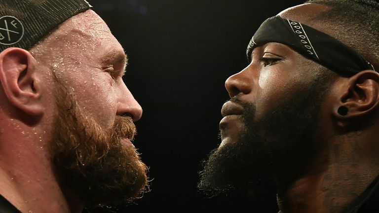 BELFAST, NORTHERN IRELAND - AUGUST 18: Tyson Fury is confronted by rival boxer Deontay Wilder after defeating Francesco Pianeta in a heavyweight contest at Windsor Park on August 18, 2018 in Belfast, Northern Ireland. (Photo by Charles McQuillan/Getty Images)