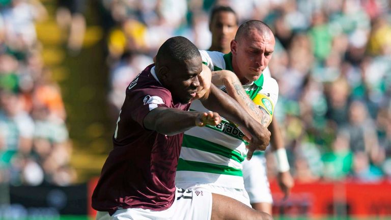 Hearts&#39; Uche Ikpeazu (L) in action with Celtic&#39;s Scott Brown.