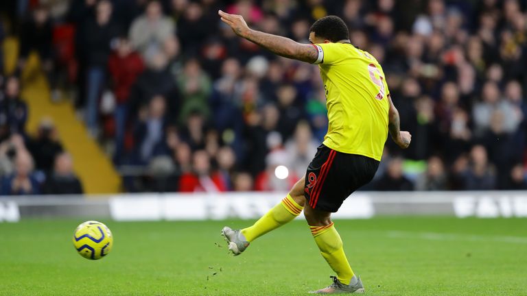 Watford captain Troy Deeney strokes home the penalty to make it 2-0