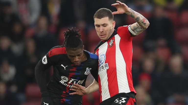 Wilfried Zaha battles for possession with Pierre-Emile Hojbjerg 