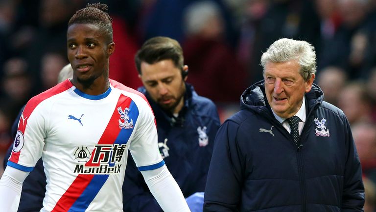 Wilfried Zaha and Crystal Palace manager Roy Hodgson during the Premier League match against Manchester United at Old Trafford on November 24, 2018