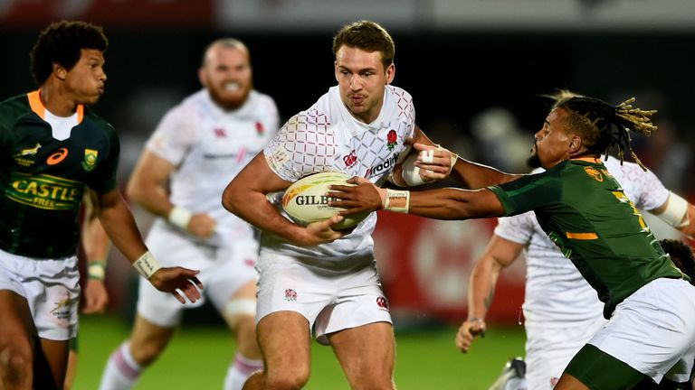 Will Muir of England is tackled by Selvyn Davids of South Africa during the match between South Africa and England on Day Two of the HSBC World Rugby Sevens Series - Dubai at The Sevens Stadium on December 6, 2019 in Dubai, United Arab Emirates.