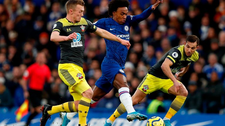 Willian is put under pressure by James Ward-Prowse and  Cedric Soares